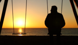 Hospice Care in Yonkers NY, man sitting on swing