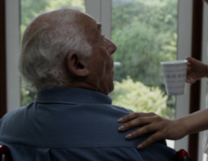 A man being given a cup of coffee in residential hospice westchester ny 