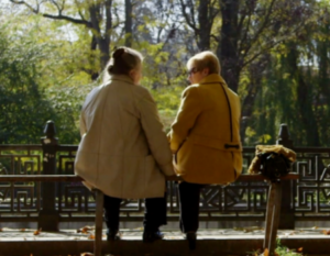 Two women talking in a park